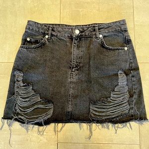 Moto by Topshop highly distressed black denim skirt,all cotton.Add edge to look!